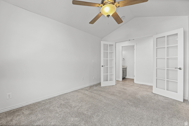 4117 North Wolf Ridge Circle Eden, UT 84310 - Photo 14 of 63 Carpeted room featuring a ceiling fan with integrated lighting, vaulted ceiling, and French doors