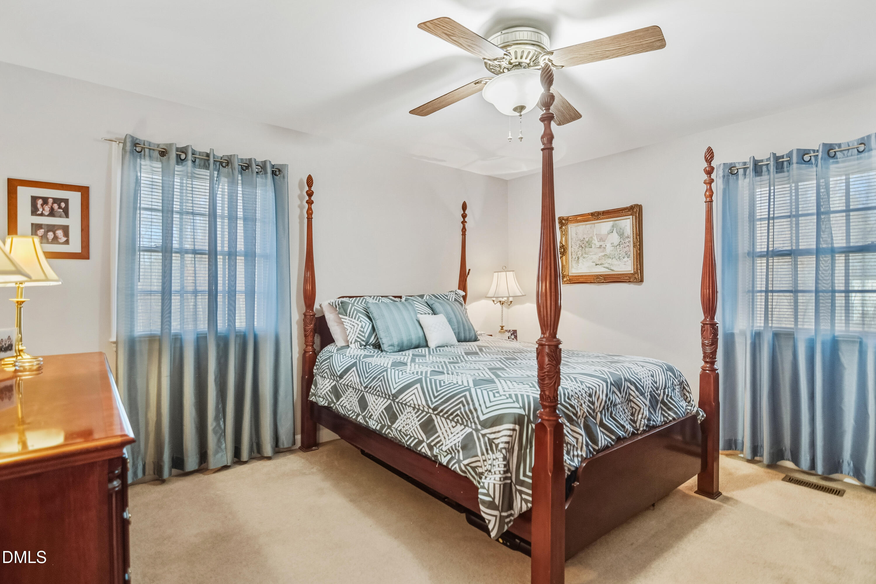 4911 Seterra Bend Durham, NC 27712 - Photo 13 of 26 a bed room with a bed and a chandelier