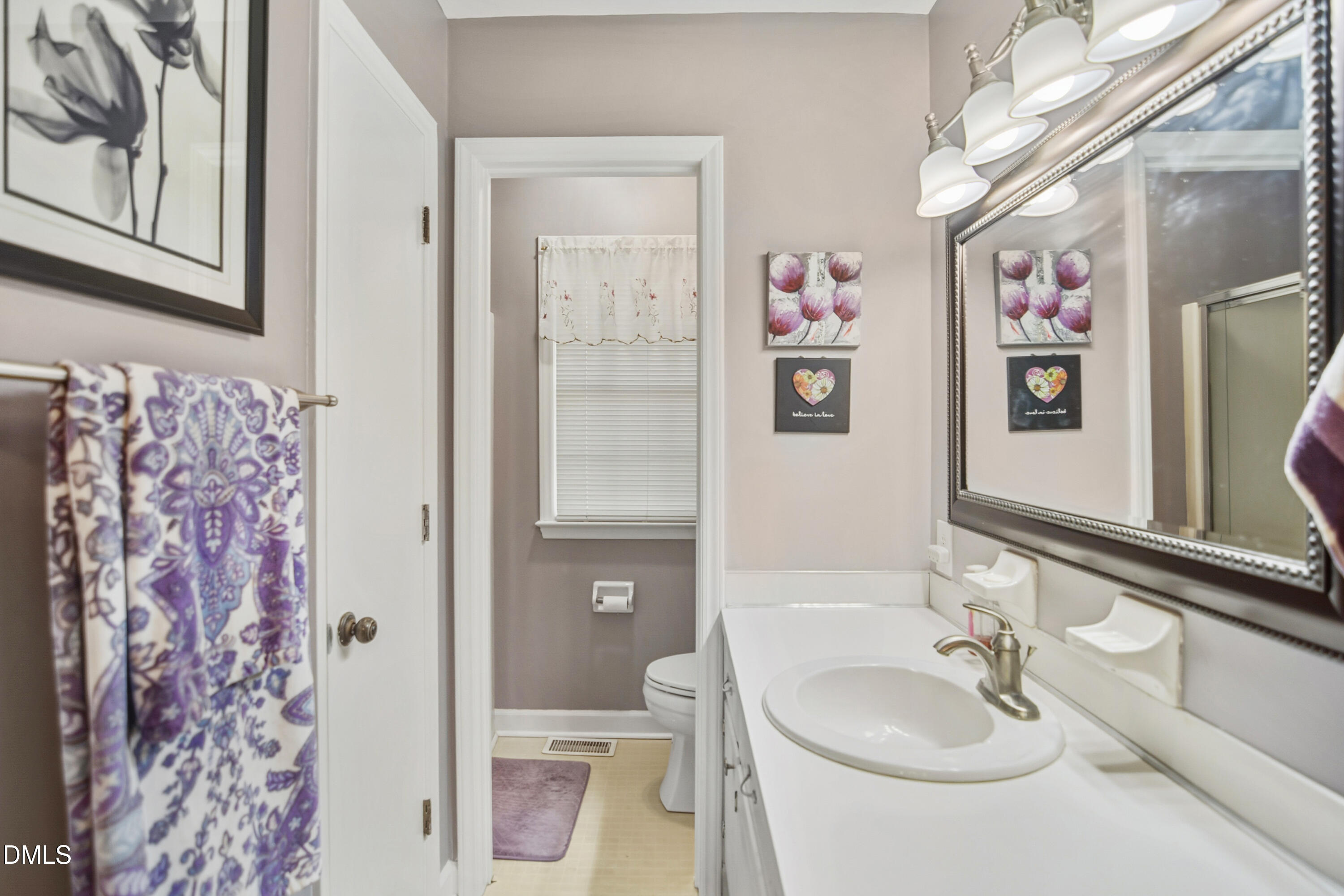 4911 Seterra Bend Durham, NC 27712 - Photo 14 of 26 a bathroom with a sink toilet and shower