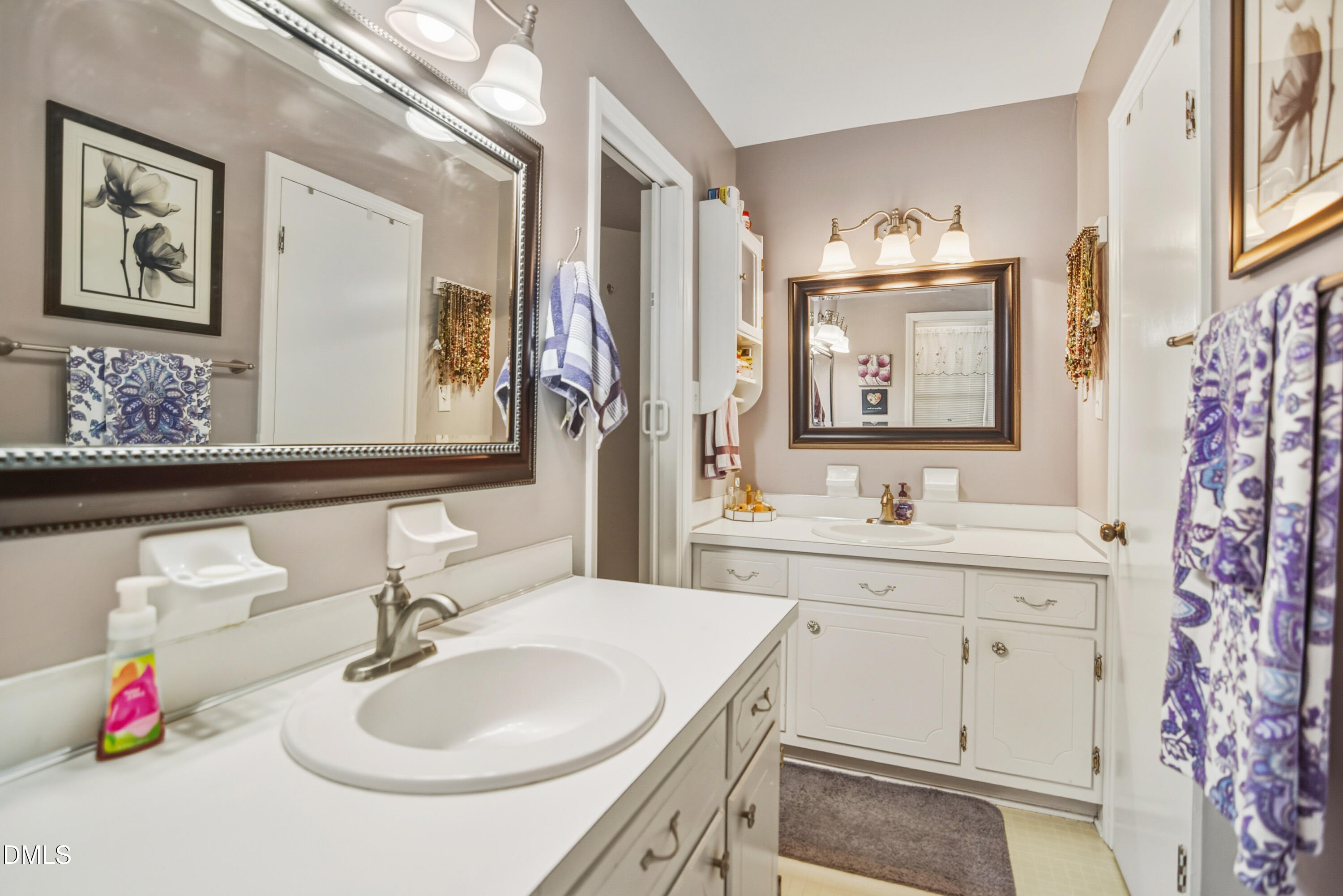 4911 Seterra Bend Durham, NC 27712 - Photo 15 of 26 a bathroom with a sink and a mirror