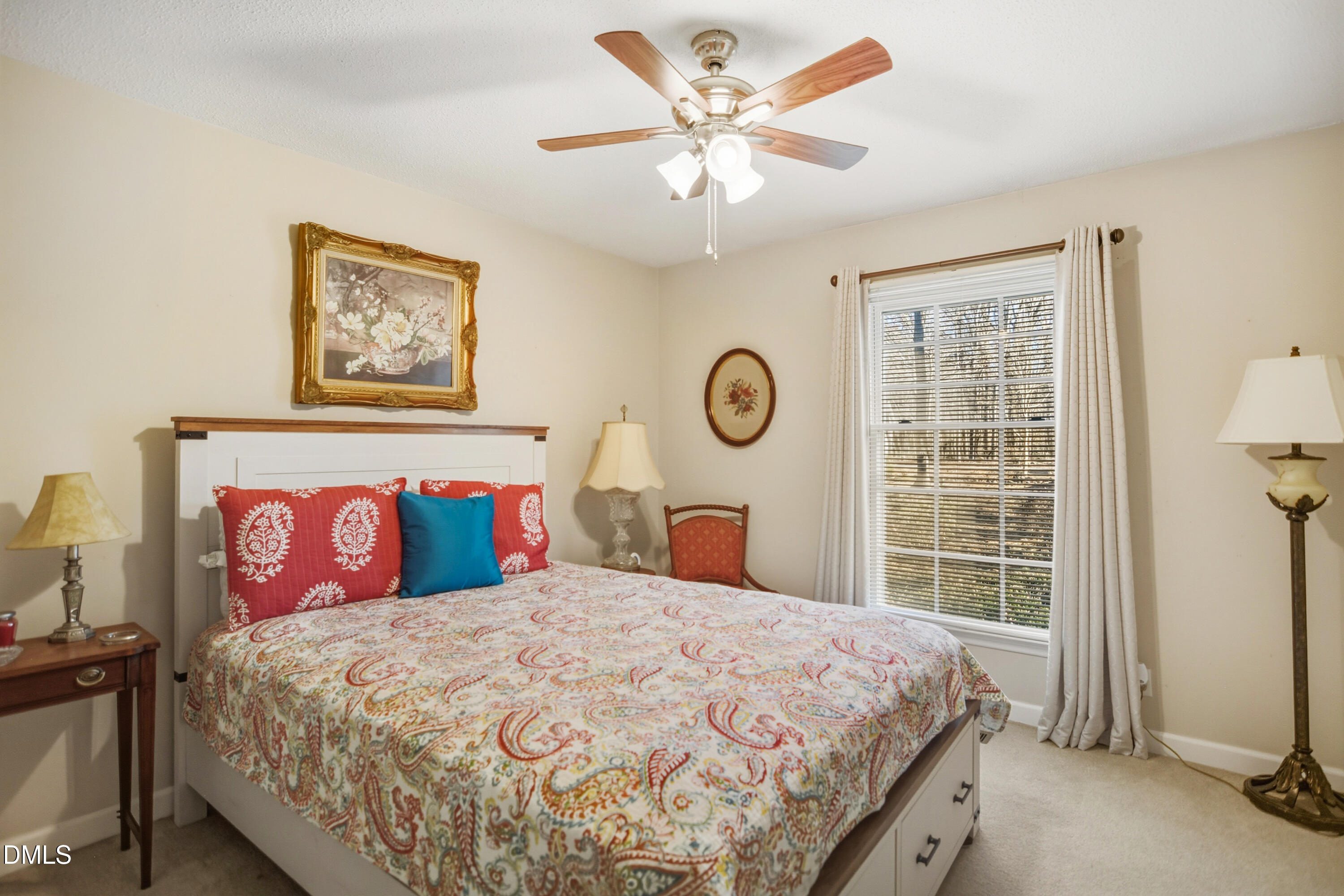 4911 Seterra Bend Durham, NC 27712 - Photo 18 of 26 a bed sitting in a bedroom next to a window