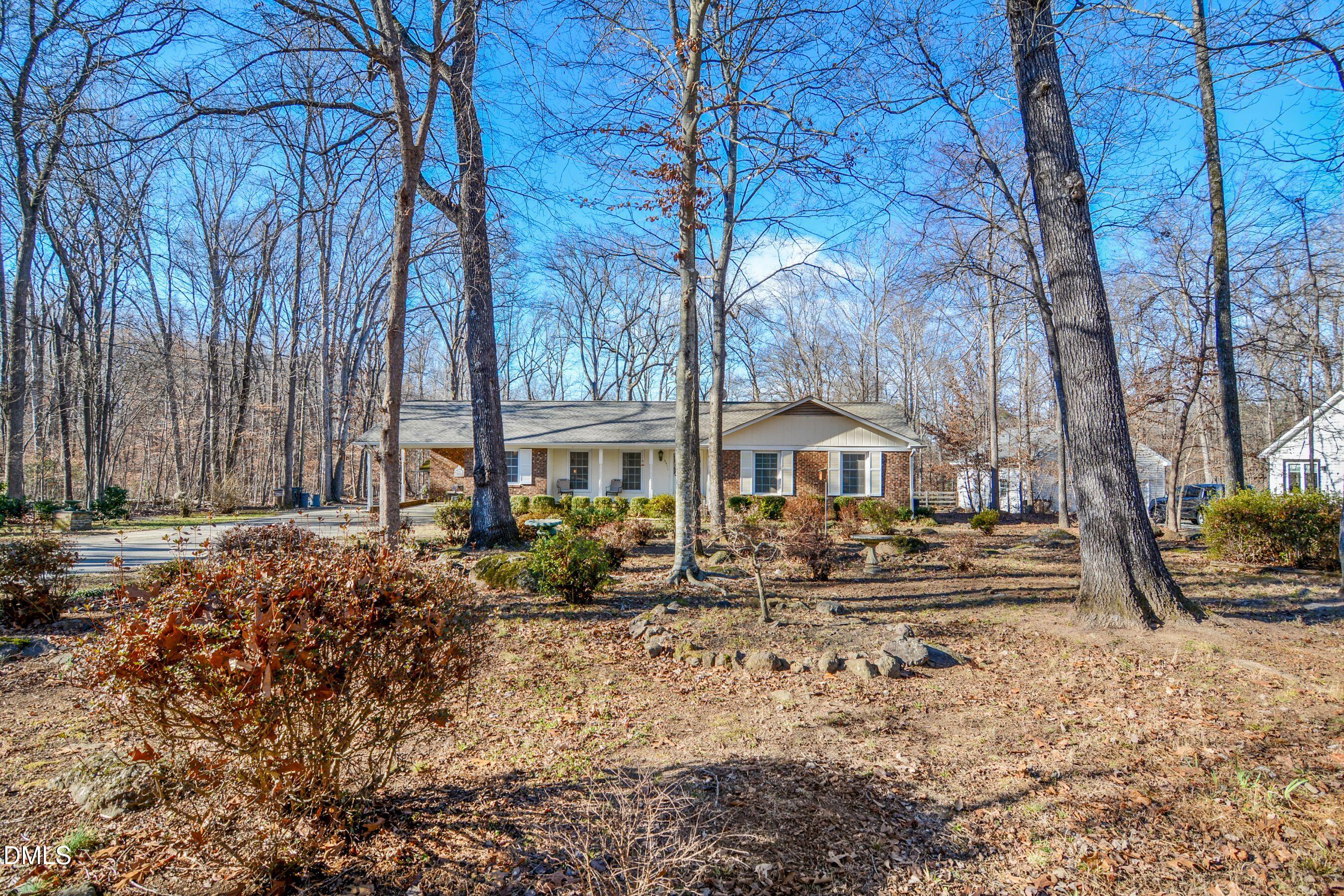 4911 Seterra Bend Durham, NC 27712 - Photo 2 of 26 a front view of a house with a yard