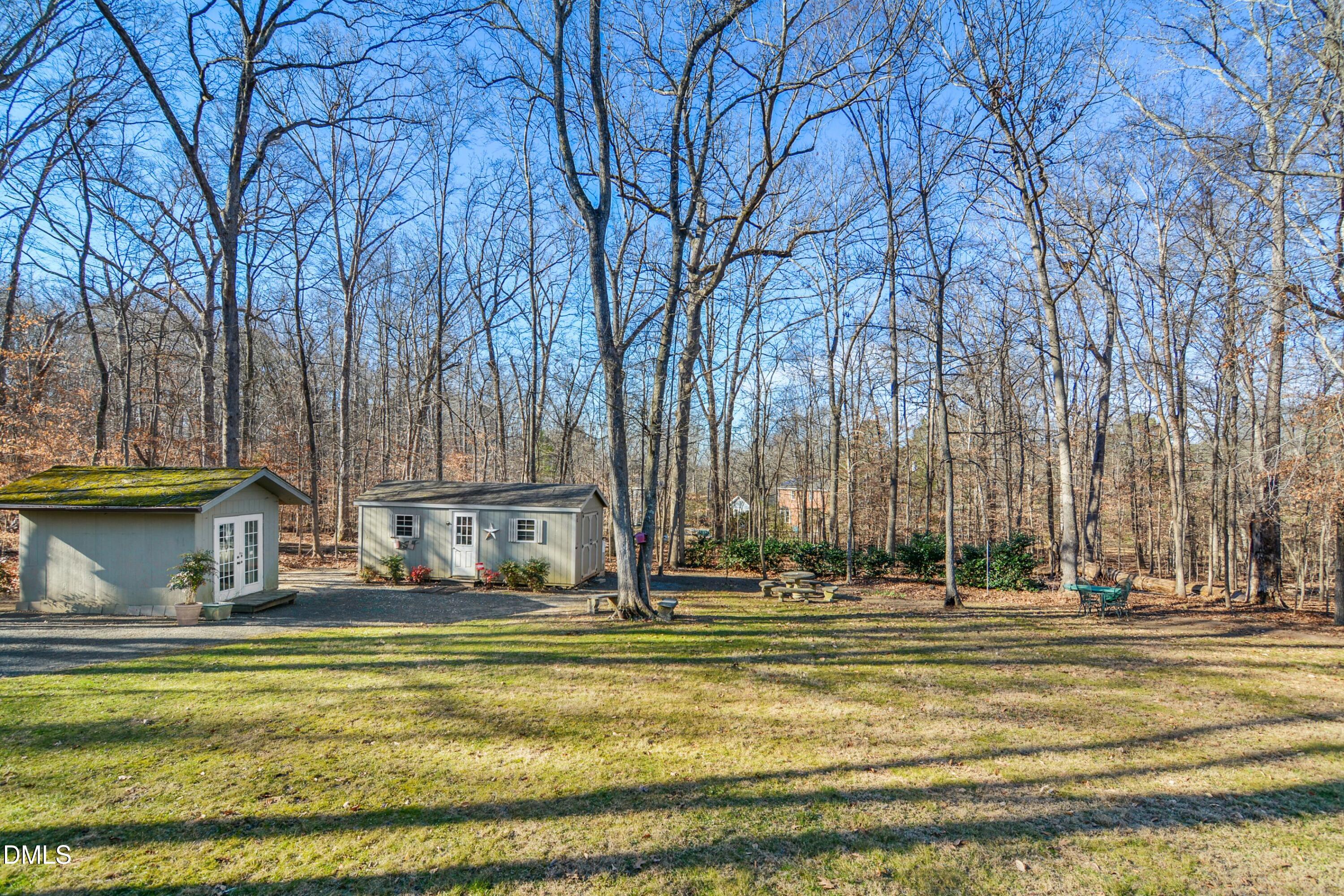 4911 Seterra Bend Durham, NC 27712 - Photo 22 of 26 a view of swimming pool with outdoor seating and trees