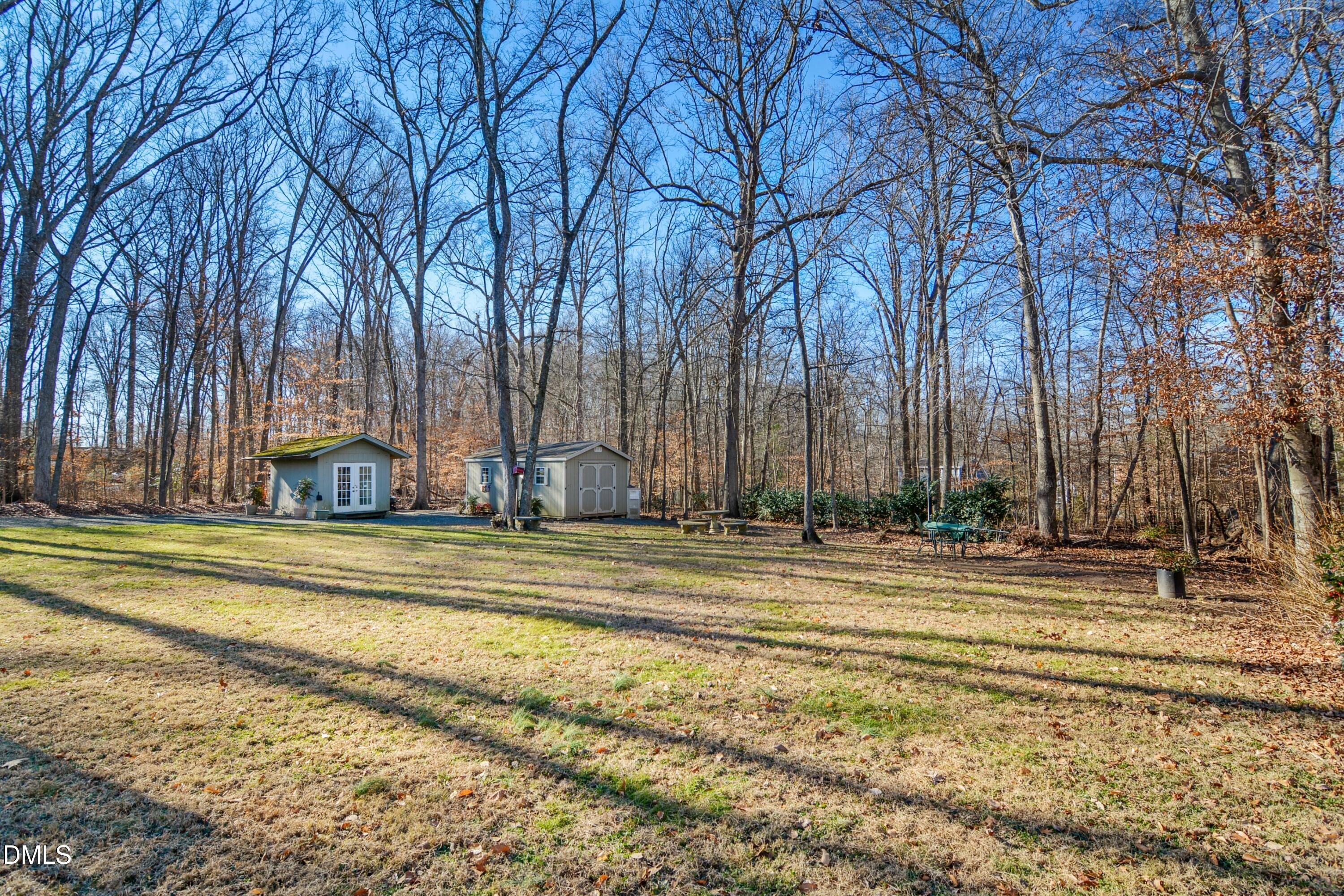 4911 Seterra Bend Durham, NC 27712 - Photo 25 of 26 a backyard of house with trees