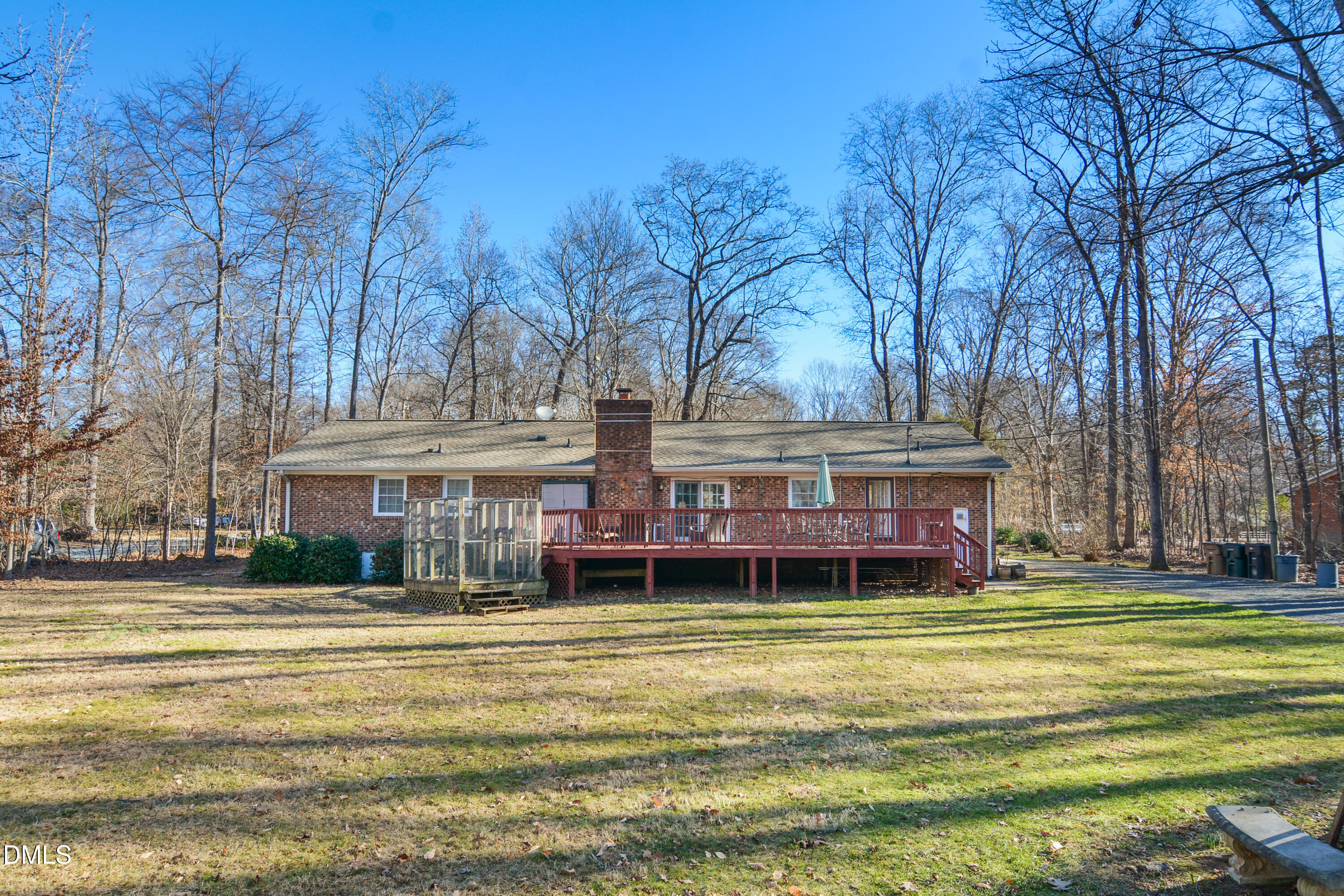 4911 Seterra Bend Durham, NC 27712 - Photo 26 of 26 a view of a house with a big yard and large trees