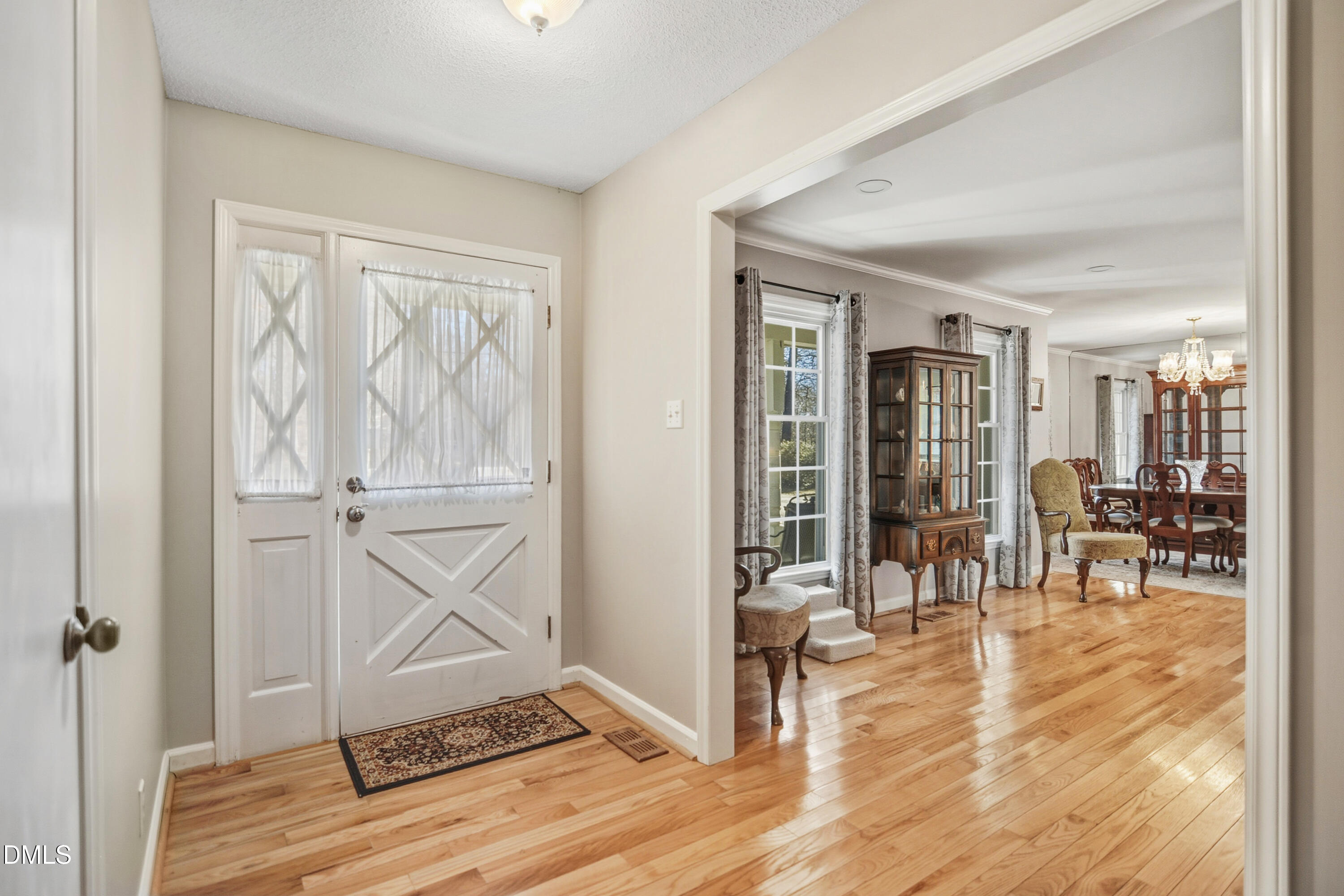 4911 Seterra Bend Durham, NC 27712 - Photo 3 of 26 a view of a livingroom with wooden floor and kitchen view