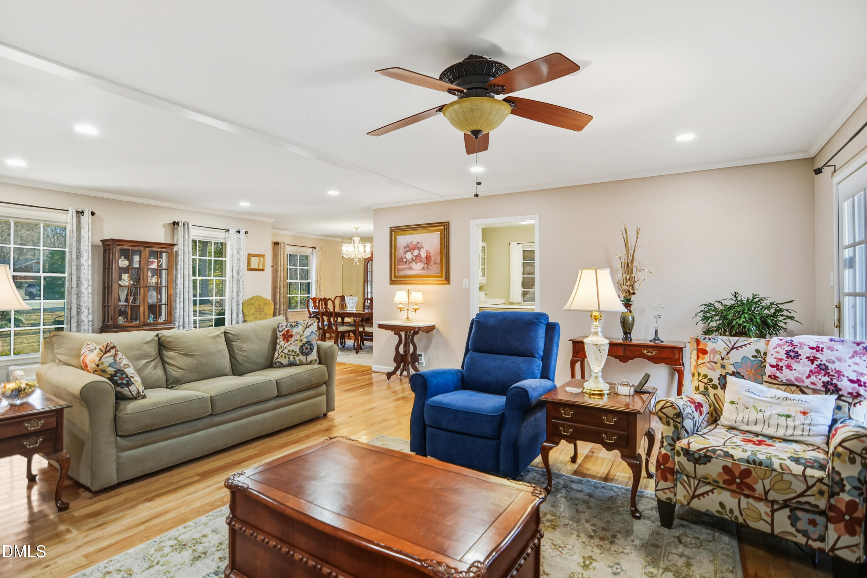 4911 Seterra Bend Durham, NC 27712 - Photo 4 of 26 a living room with furniture ceiling fan and a rug