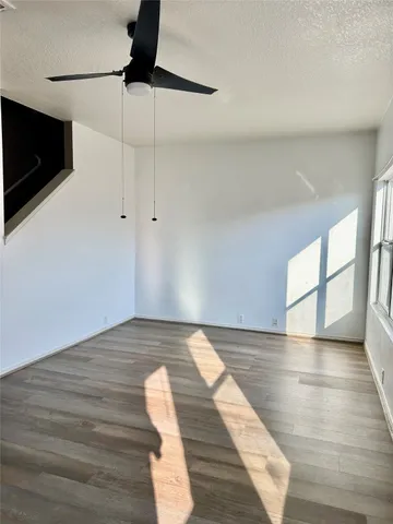 a view of an empty room with a flat screen tv