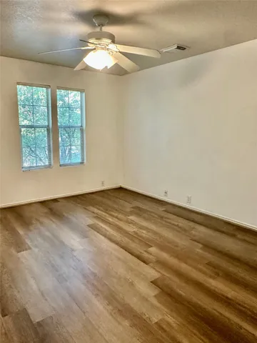 a bedroom with bed and a window