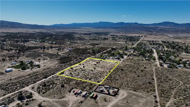 an aerial view of residential house and outdoor space