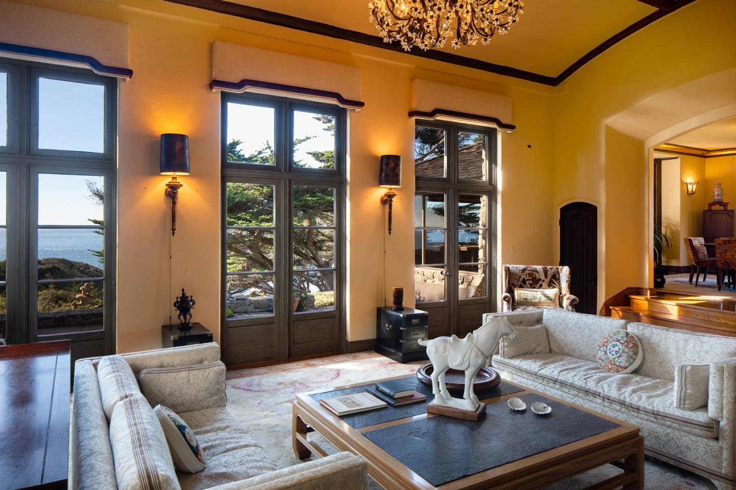 171 Spindrift Road Carmel, CA 93923 - Photo 13 of 37 a living room with furniture and large windows