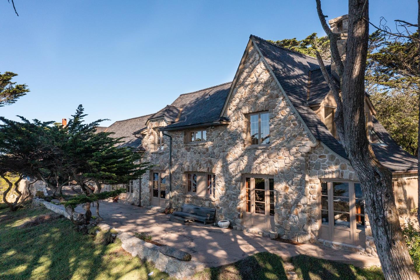 171 Spindrift Road Carmel, CA 93923 - Photo 22 of 37 a view of a house with a yard