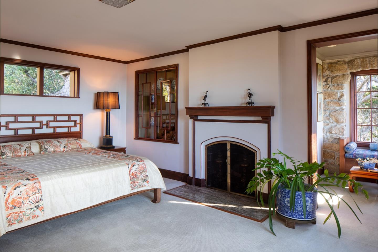 171 Spindrift Road Carmel, CA 93923 - Photo 23 of 37 a bedroom with a bed and a fireplace