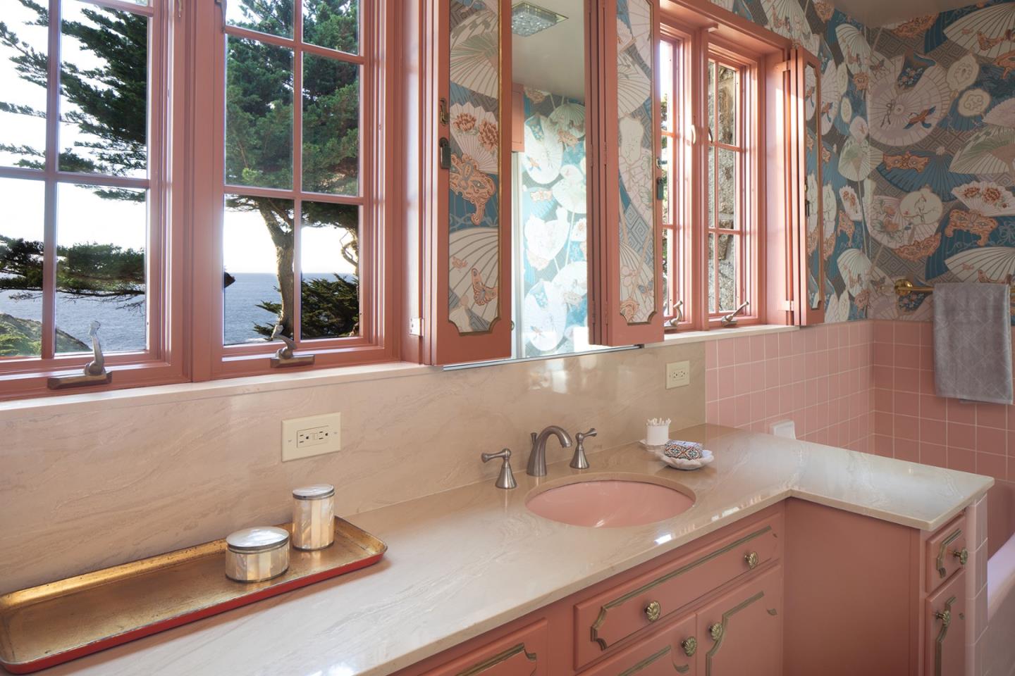 171 Spindrift Road Carmel, CA 93923 - Photo 25 of 37 a bathroom with a sink and a window