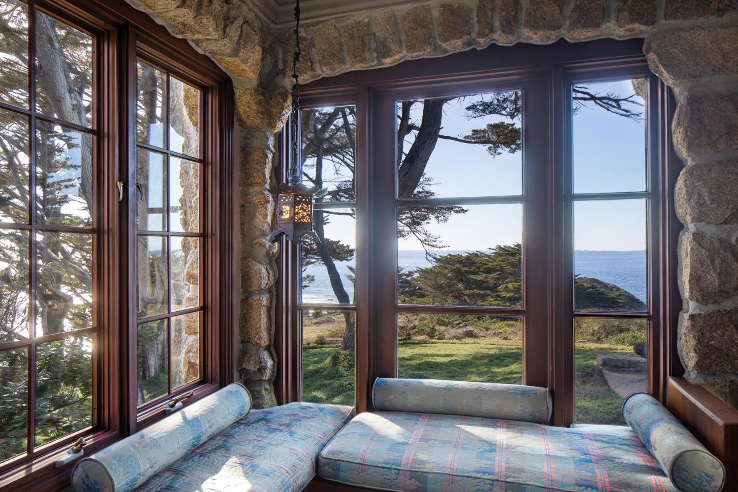 171 Spindrift Road Carmel, CA 93923 - Photo 26 of 37 a view of a porch with furniture and floor to ceiling window