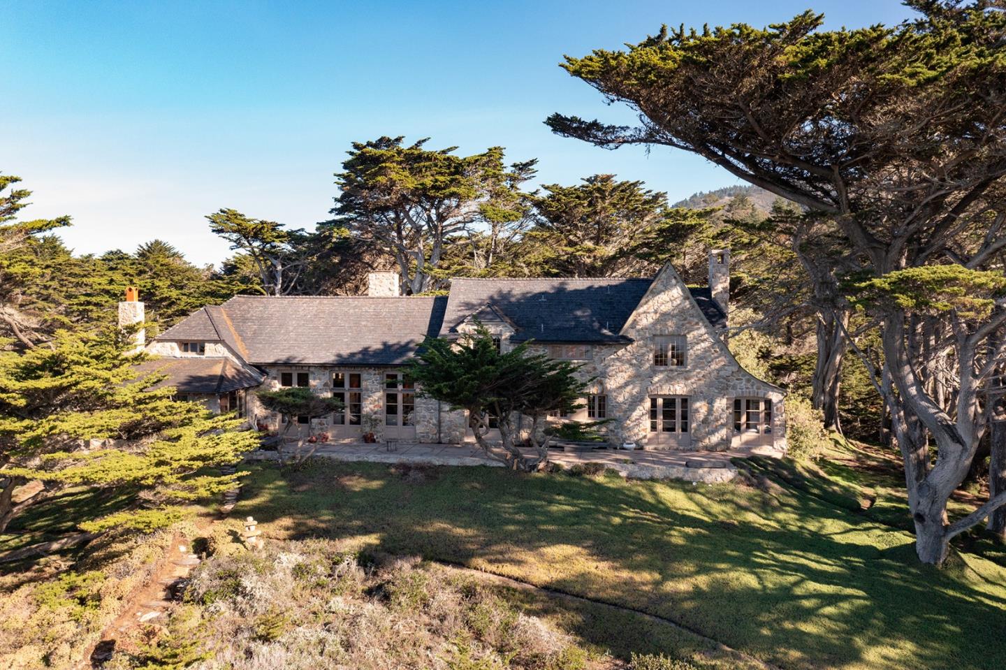 171 Spindrift Road Carmel, CA 93923 - Photo 4 of 37 a view of house with swimming pool and outdoor seating
