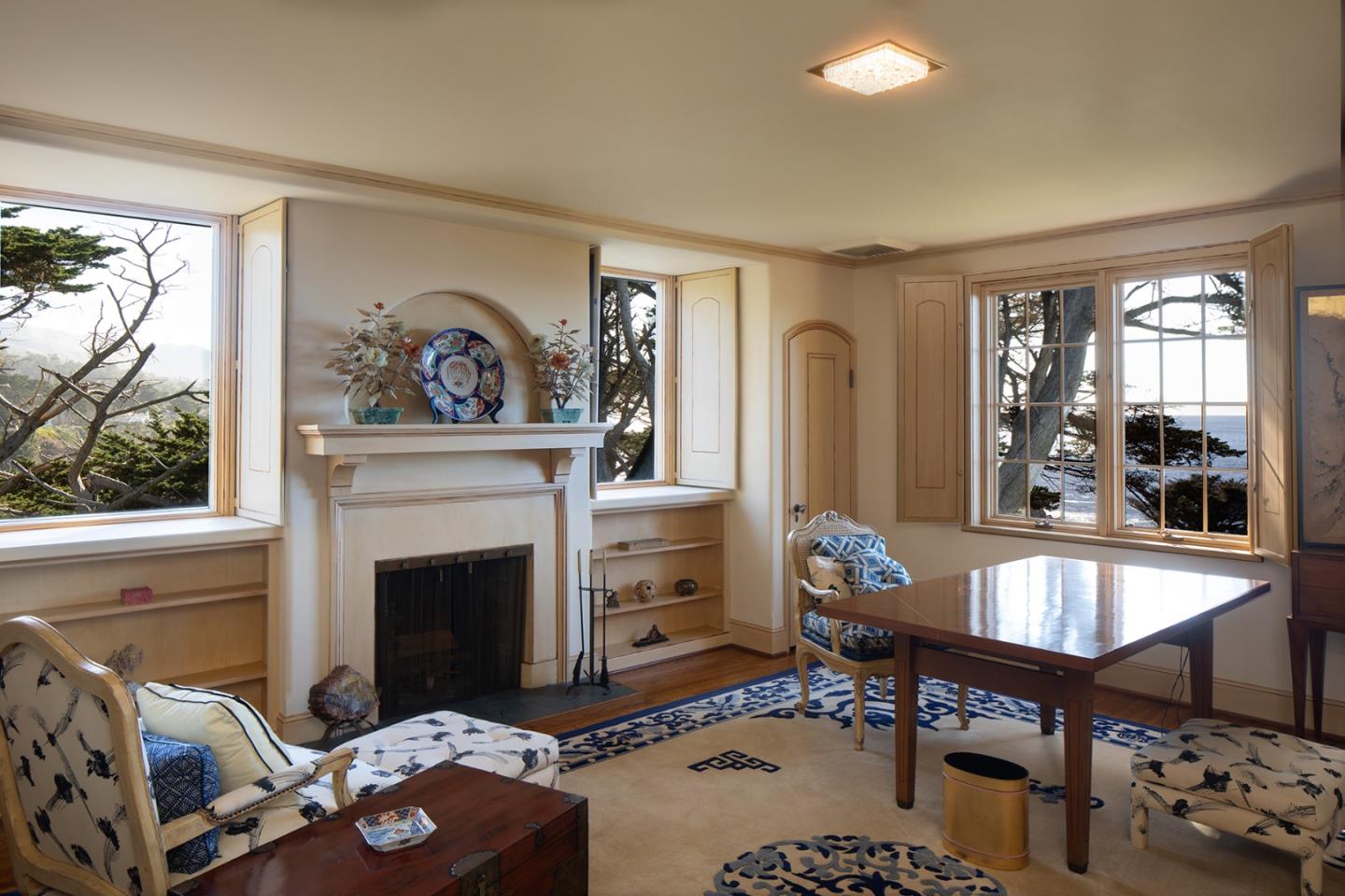 171 Spindrift Road Carmel, CA 93923 - Photo 32 of 37 a living room with furniture and a fireplace