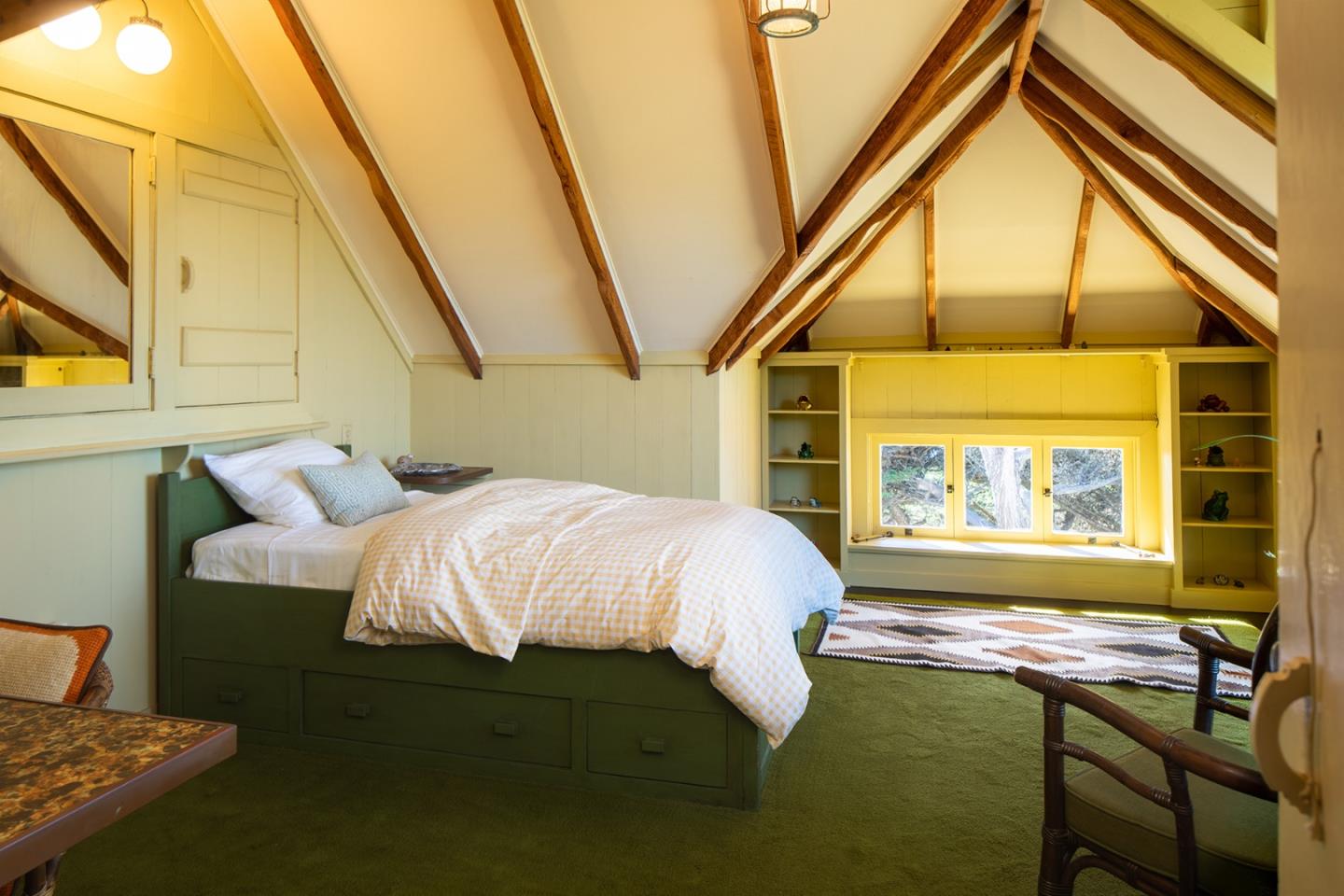 171 Spindrift Road Carmel, CA 93923 - Photo 34 of 37 a bed sitting in a bedroom next to a window