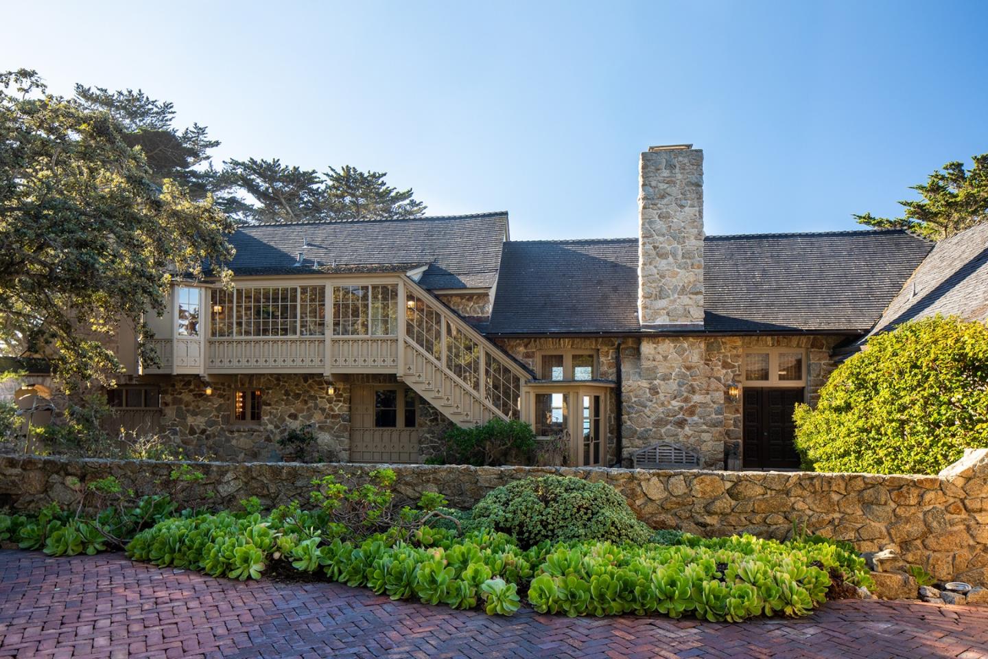 171 Spindrift Road Carmel, CA 93923 - Photo 10 of 37 a front view of a house with a garden