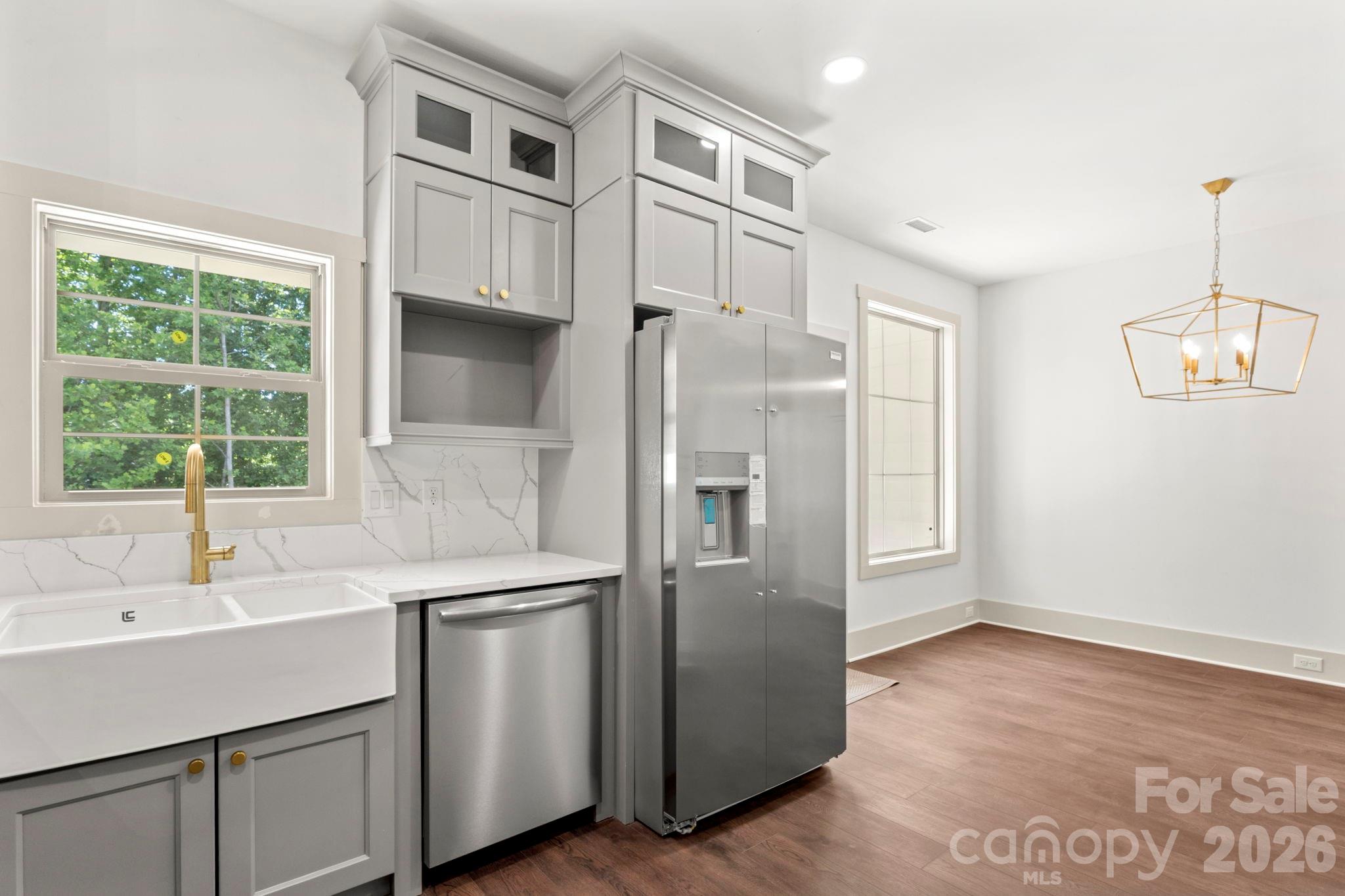 1167 Tirzah Road Rock Hill, SC 29732 - Photo 8 of 25 a kitchen with stainless steel appliances a sink cabinets and a window