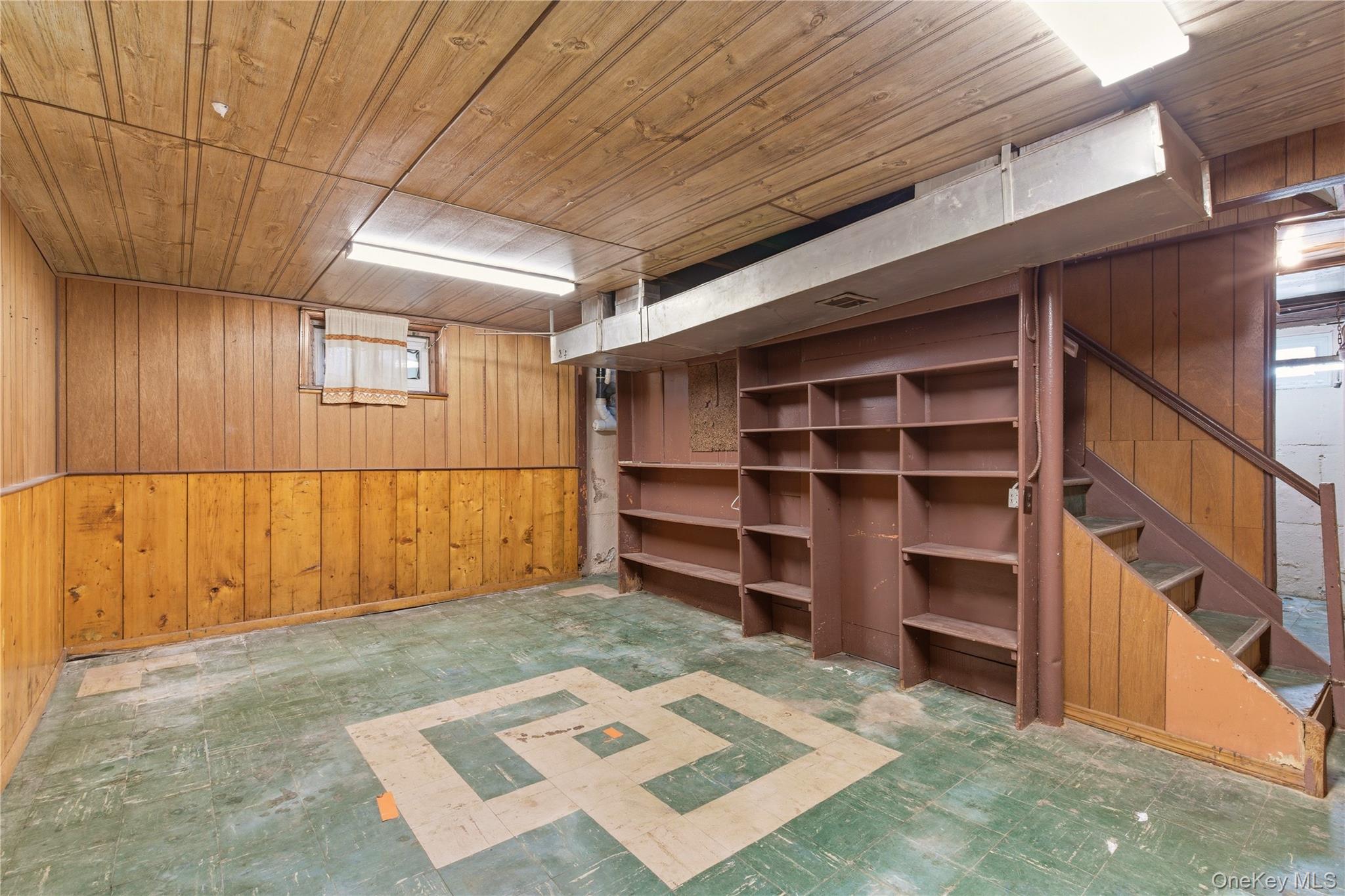325 White Road Mineola, NY 11501 - Photo 12 of 17 a view of a room with wooden floor and cabinet