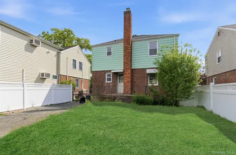 a house view with a garden space