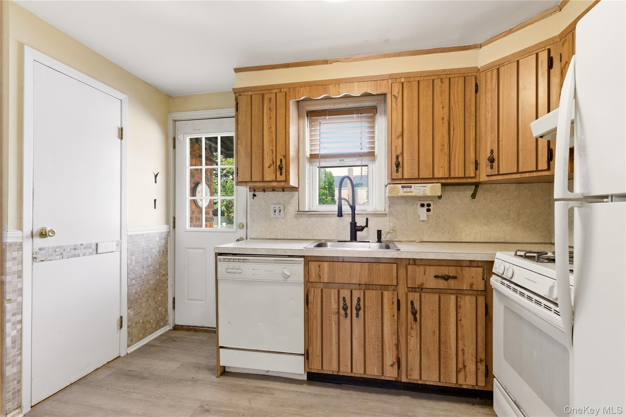 325 White Road Mineola, NY 11501 - Photo 7 of 17 a kitchen with a sink cabinets and appliances