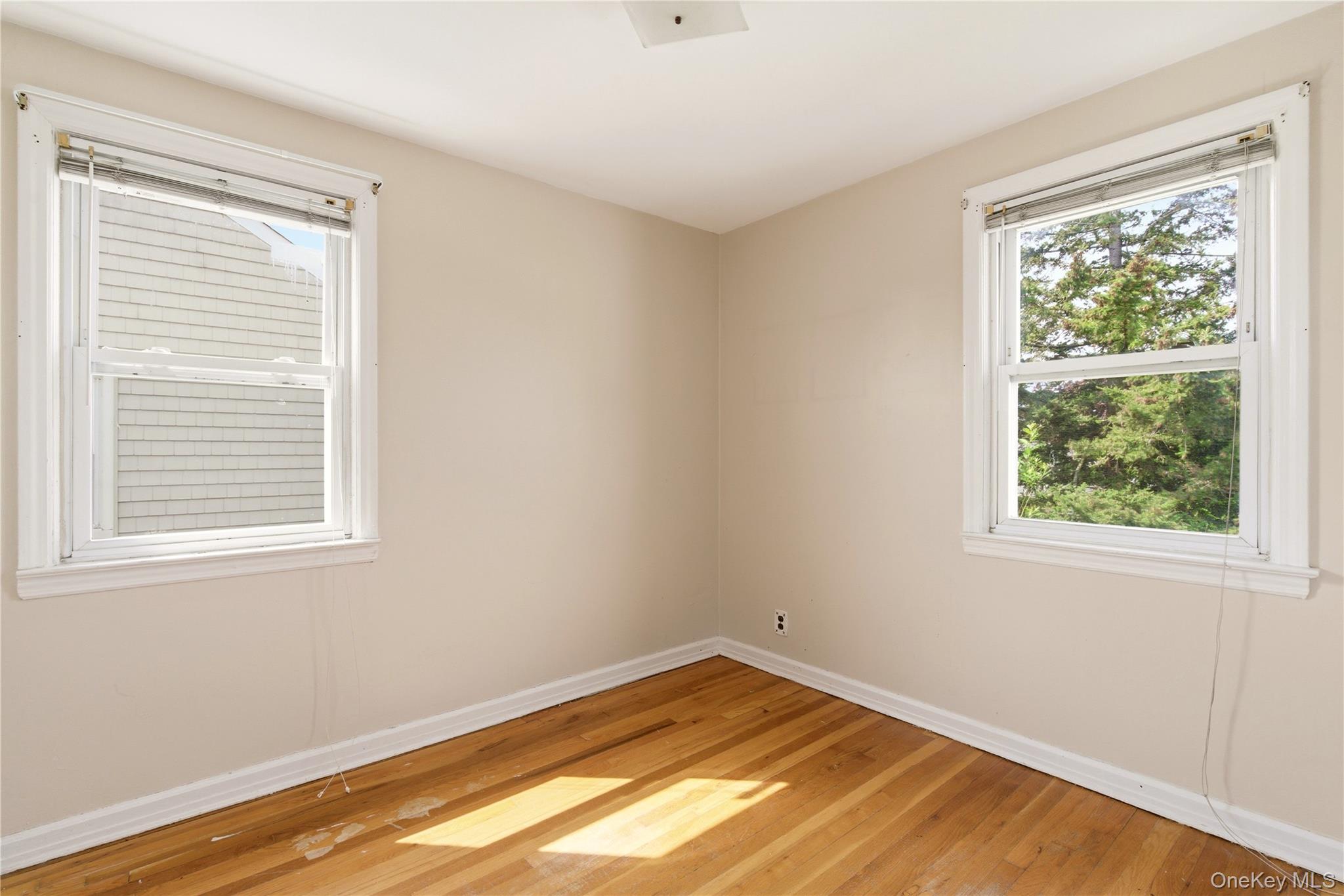 325 White Road Mineola, NY 11501 - Photo 10 of 17 an empty room with a window