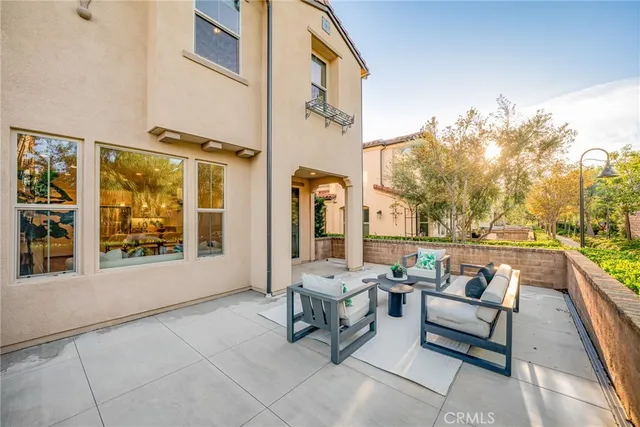 a lobby with furniture and large windows