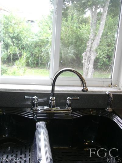 8049 Country Road, Unit 203 Fort Myers, FL 33919 - Photo 9 of 10 a close view of sink and tap