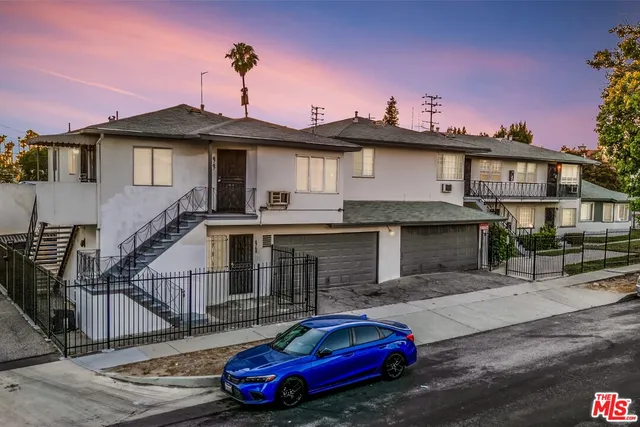 a front view of a house with parking