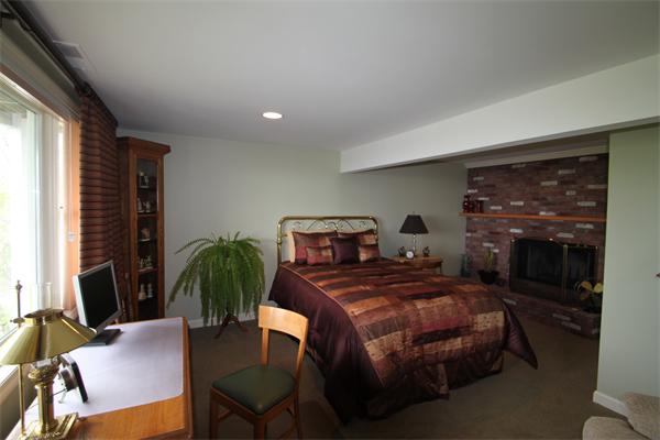 6 Gilbert Heights Road Marblehead, MA 01945 - Photo 9 of 15 a bedroom with furniture and a fireplace
