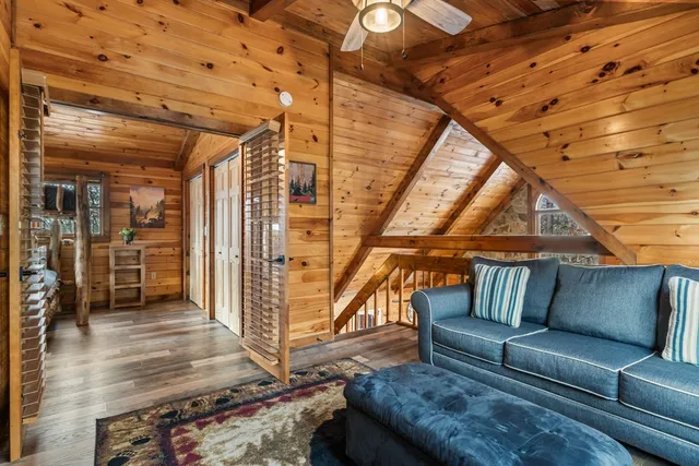 a blue couch sitting in a living room with a couch