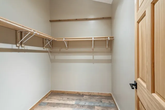 a view of an empty walk in closet