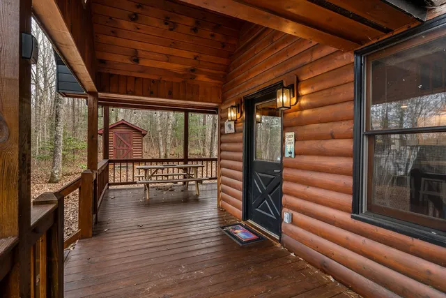a view of entryway with wooden floor and stairs
