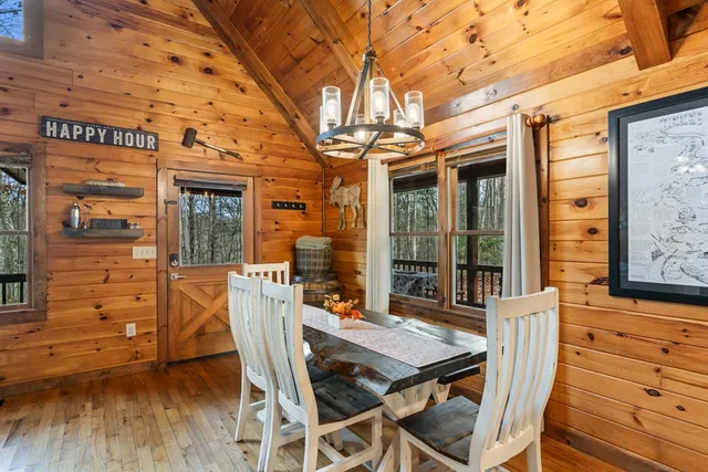 a view of a patio with table and chairs and potted plants