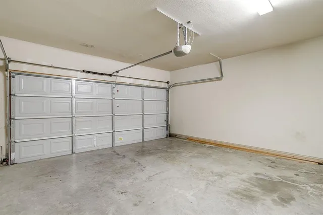 an empty room with projector & cabinets
