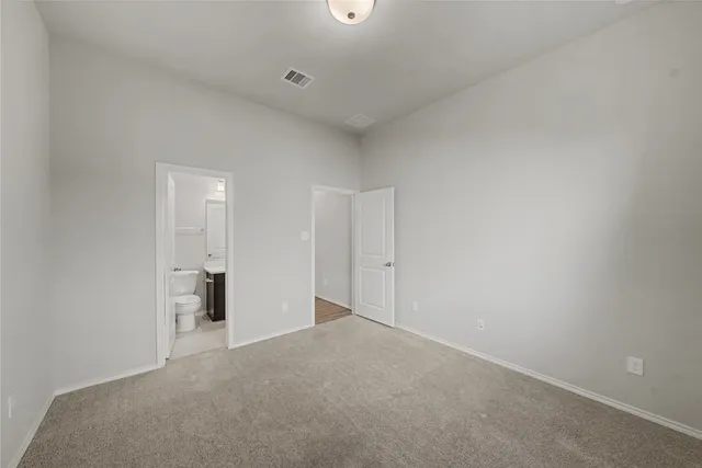 a view of a kitchen with a sink and a refrigerator