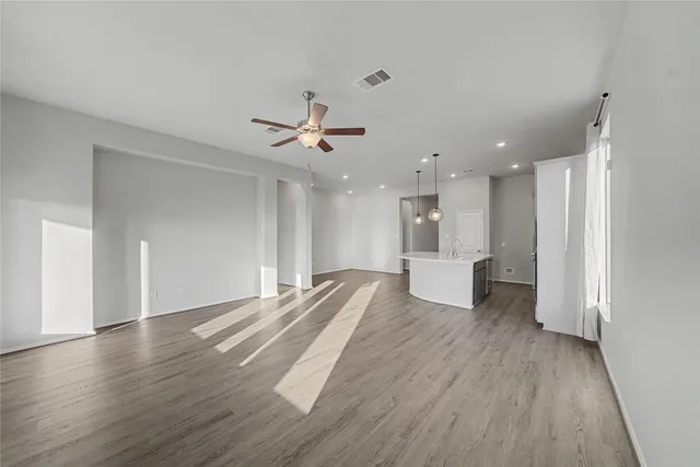 a bathroom with a sink double vanity granite tub shower and a mirror