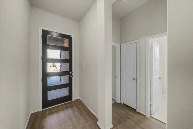 a bathroom with a sink mirror and a toilet