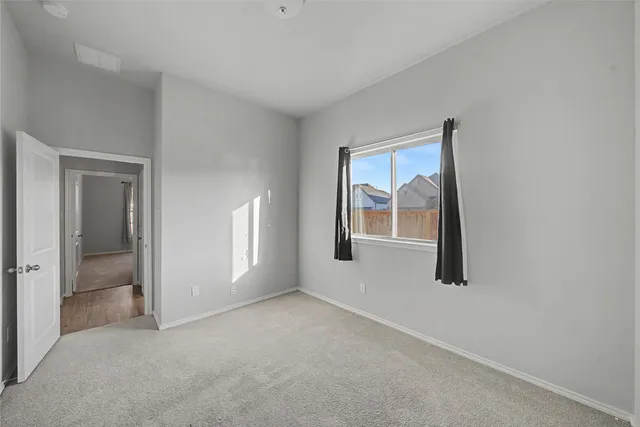 a large kitchen with kitchen island a sink stainless steel appliances and cabinets