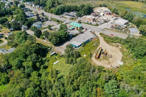 an aerial view of a house with a yard