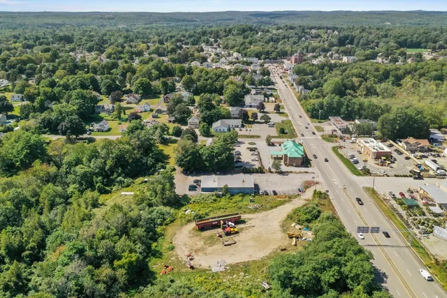an aerial view of a house with a yard