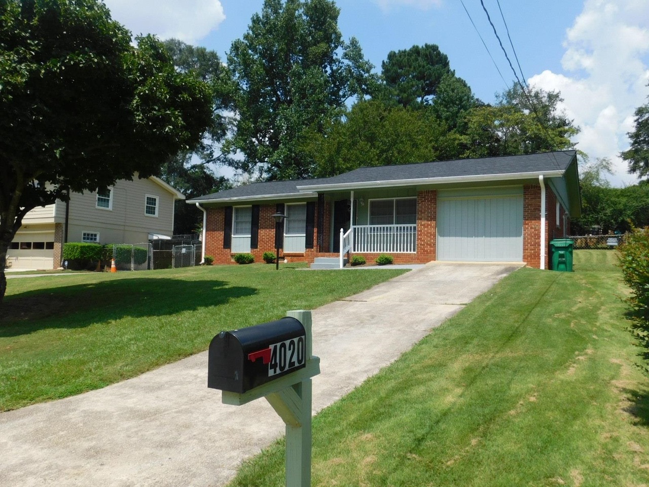 4020 Snapfinger Way Decatur, GA 30035 - Photo 1 of 1 a front view of a house with a yard table and chairs