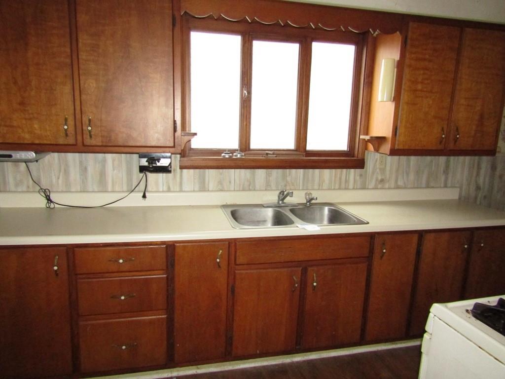 255 State Street Baden, PA 15005 - Photo 12 of 24 a kitchen with a sink cabinets and a window