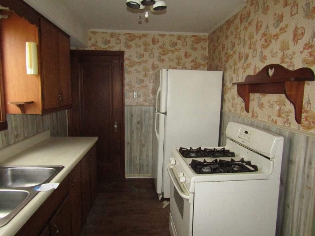 255 State Street Baden, PA 15005 - Photo 13 of 24 a kitchen with a stove and a refrigerator
