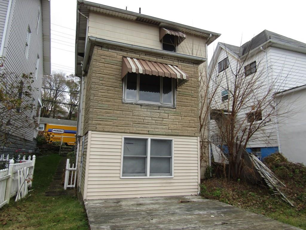 255 State Street Baden, PA 15005 - Photo 5 of 24 a front view of a house with garage
