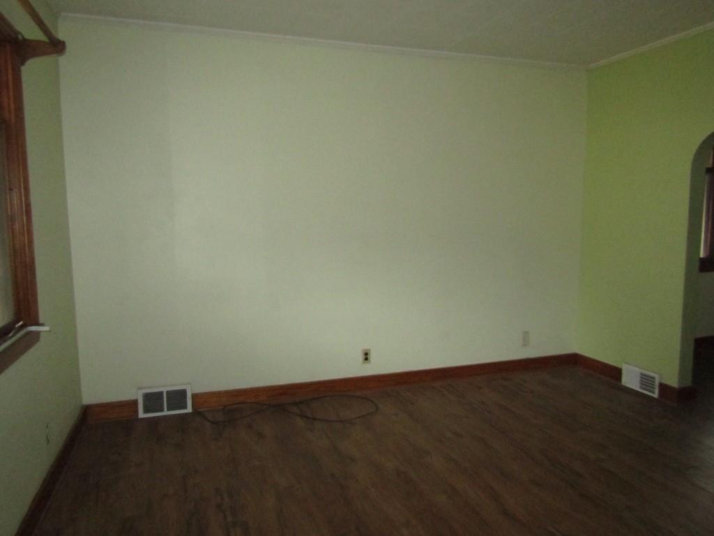 255 State Street Baden, PA 15005 - Photo 7 of 24 an empty room with wooden floor and windows