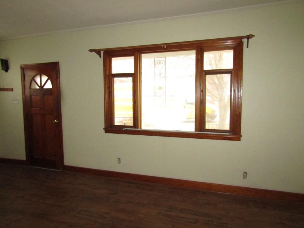 255 State Street Baden, PA 15005 - Photo 9 of 24 a view of an empty room with wooden floor and a window