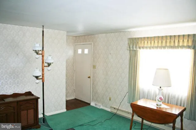 a bedroom with a bed and a table in it